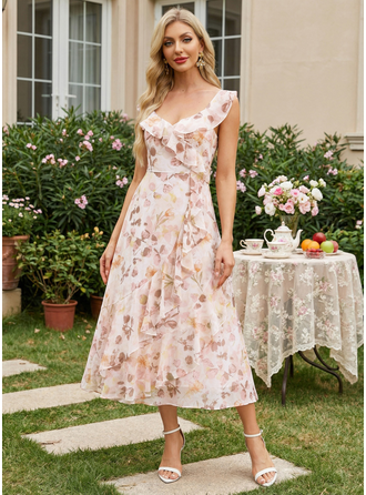 Klänning Midi i Chiffong med Blomtryck